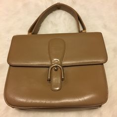 "Vintage Camel colored purse with 1 zippered pocket and 2 open pockets inside. No brand or material labels or markings. Appears to be leather. Has cracking from use, age, and storage but still beautiful. Approximate measurements: 7\" x 8\" x 2.5\" with 4\" handle" Vintage Handheld Satchel With Zipper Closure, Vintage Double Handle Shoulder Bag With Zipper Closure, Vintage Double Handle Shoulder Bag With Zipper, Vintage Handheld Bags With Zipper Closure, Vintage Light Brown Tote Bag, Vintage Beige Bag With Zipper Closure, Vintage Beige Shoulder Bag With Zipper Closure, Retro Beige Bag With Zipper Closure, Retro Beige Shoulder Bag With Zipper Closure