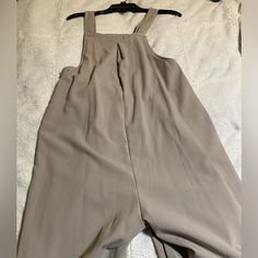 Pantalon Women’s Dressy Or Casual Overalls, New With Tag Size Small, Has Pockets In The Front, Super Cute With Wide Legs Chic Overalls With Pockets, Spring Workwear Full-length Jumpsuits And Rompers, Spring Workwear Non-stretch Overalls, Beige Overall Bottoms With Pockets, Fitted Wide Leg Overalls For Workwear, Full Length Jumpsuits And Rompers For Spring Workwear, Chic Wide Leg Overalls For Work, Chic Workwear Overalls, Solid Color Overalls For Work