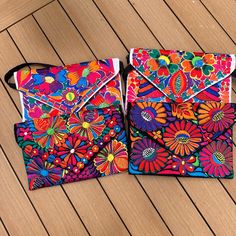 Mexican Embroidered Purses Black (Design varies) or White (Design varies) Can wear over the shoulder, cross body or a stunning clutch.  Perfect for spring, summer and a beach vacation! Multicolor Embroidery Beach Bags, Summer Multicolor Embroidered Clutch, Summer Multicolor Rectangular Clutch, Multicolor Rectangular Summer Clutch, Floral Embroidered Bags For Summer Vacation, Spring Beach Bag With Floral Embroidery, Spring Beach Bags With Floral Embroidery, Summer Vacation Bags With Floral Embroidery, Floral Embroidered Summer Vacation Bags