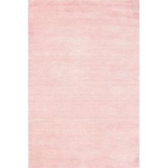 an area rug with pink colors on the floor