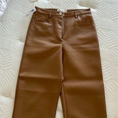 Brown Leather Aritzia Pants. Brand New With Tags Brown Tapered Leg Bottoms For Fall, Spring Brown Trousers, Brown High-waisted Wide Leg Pants For Spring, Brown Wide-leg Leather Pants With Pockets, Brown Wide Leg Leather Pants With Pockets, Brown High Waist Leather Pants, Brown Ankle-length Pants With Belt Loops, Brown High-waist Leather Pants, Brown High Waist Wide Leg Pants For Spring