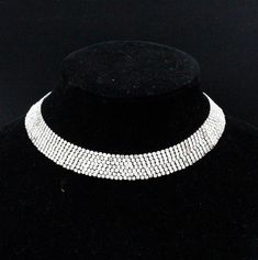 "DESCRIPTION: Elevate your vintage jewelry collection with this designer necklace crafted by Les Bernard during the glamorous 1960s. This choker collar necklace is a true testament to timeless elegance, adorned with a dazzling array of rhinestones that catch the light with every movement. The piece is proudly marked with \"LES BERNARD INC.,\" a symbol of its exquisite craftsmanship. While a few stones may have dulled slightly over time, the necklace remains a captivating and treasured accessory. Cocktail Necklace, Fancy Cocktails, Choker Collar Necklace, Designer Necklace, Rhinestone Choker, Necklace Craft, Choker Collar, Lovely Ring, Choker Necklaces