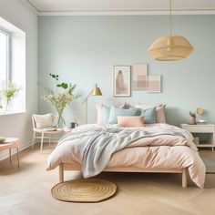 a bedroom with light blue walls and wooden floors