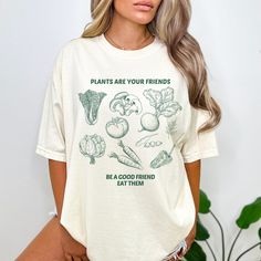 Gardening Shirt Retro Veggies Shirt Funny Plant Shirt Vegetables T-Shirt Gift for Vegan Vegetarian Tee Farmers Market Garden Shirt for Women ❤ Our Luxury T-shirts are pure comfort! Each piece is thoughtfully designed as UNISEX, ensuring a perfect fit in true UNISEX sizes. And of course, you can elevate your style with an effortlessly oversized look by ordering 1 or 2 sizes up. ❤ Select your favorite shirt color and font to create a personalized design! ❤Our commitment to quality is reflected in our use of a high-grade ink printing method, delivering graphics with a sharp and crisp appearance. The ink seamlessly integrates with the fibers, ensuring both vibrant visuals and remarkable durability for your apparel. ❤ Luxury Comfort Colors Brand ❤100% cotton - premium quality, medium fabric wei Organic Relaxed Fit Crew Neck Tops, Green Organic Relaxed Fit T-shirt, Relaxed Fit Graphic Print Shirt For Gardening, Relaxed Fit Shirt With Graphic Print For Gardening, Organic Cotton T-shirt For Spring, Organic Green Short Sleeve Top, Organic Crew Neck Tops For Spring, Organic Tops With Graphic Print For Spring, Organic Graphic Print Top For Spring