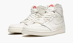 Once again, Jordan Brand dresses the Air Jordan 1 High in a tonal look.  The second ever “Premium Essentials” release sees MJ’s first signature sneaker return in Sail, a clean off-white colorway.  The result is a simple shoe that you can dress up or wear casually.  A textured tumbled leather appears throughout the upper.  The famous “Wings” logo maintains its usual resting place on the ankle.  Nike branding on the tongue features a hit of red, the lone deviation from the monochromatic color sche Simple Shoes, Brand Dresses, Nike Air Jordans, Air Jordan 1 Retro High Og, Air Jordan 1 Retro High, Swag Shoes, Air Jordan 1 High, Jordan 1 High, Air Jordan 1 Retro