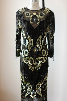 "Beautiful Beaded sequined Dress!! This is all silk...has a see through neck...with beads...and hanging beaded fringe throughout..just the right amount! Absolutely in Excellent condition with zip up back..oh wow this is a beauty!! Measuring: 45\" length Bust: 38\" Waist: 28\" Hip: 38\" Sleeves:22\" Beautiful!! Pet Free/smoke free Enjoy!" Gatsby Style Dresses, Halter Wedding, Beaded Party Dress, Gatsby Style, Sequined Dress, Flapper Style, Beaded Gown, 1920s Fashion, Sequin Beading