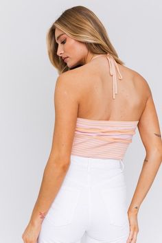 Radiate sunshine, summer and sweetness in this halter crop top! The perfect top for a concert, sunset dinner or a summer date night with your crush! We'd wear this beauty with denim shorts or white pants to complete the look. Add your favorite sandals or heels to be event-ready. Halter Neckline Ribbed Cropped Adjustable Tie Model is 5'9 and wearing a size S. Recommended Sizing. 2-4 S, 6 M, 8-10 L. Flirty Tube Top For Summer Vacation, Chic Summer Halter Neck Tops, Chic Spring Halter Top For Day Out, Chic Halter Neck Tops For Summer, Chic Spring Vacation Halter Top, Chic Spring Halter Top For Vacation, Halter Neck Tops For Spring Day Out, Chic Halter Top For Beach Season, Chic Fitted Halter Top For Summer