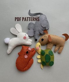 four different stuffed animals sitting next to each other on top of a gray surface with the words free pattern