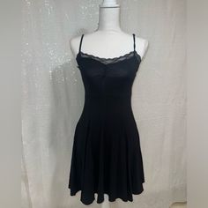 Brand New Never Worn. Size Xs, No Damage. Adjustable Straps And Gathered Lace Trim Bust. Very Stretchy Measurement Lying Flat: Armpit To Armpit 12” Waist 12” Armpit To Hem 26” Black Stretch Mini Dress With Lace Trim, Black Stretch Mini Dress Casual, Fitted Black Mini Dress With Lace Trim, Flirty Black Fit And Flare Mini Dress, Casual Fitted Mini Dress With Spaghetti Straps, Stretch Mini Dress With Lace Trim For Night Out, Black Lined Fit And Flare Mini Dress, Black Fit And Flare Lined Mini Dress, Black Mini Dress With Lace Trim For Spring