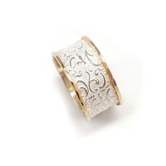 The lacy, delicate pattern is what makes this wide silver ring a popular choice. The ring is edged with yellow gold hoops. Width: 0.4 inch / 10 mm This listing is for sizes 4-13- Just convo me your size. For other sizes - please convo me. Additional information If you liked this item, you may also want to look at these pieces: http://etsy.me/2eHQooV http://etsy.me/2fWcR7M For customer reviews of our shop: http://etsy.me/2eOQZZt Back to our shop: http://www.etsy.com/shop/ilanamir To see more of I Elegant White Engraved Hallmarked Ring, Elegant Wide Band Filigree Ring With Intricate Design, Elegant Etched Filigree Ring For Anniversary, White Gold Engraved Wide Band Wedding Ring, Elegant Etched Filigree Anniversary Ring, Etched Wide Band Wedding Rings, Engraved Wide Band Ring For Wedding, Elegant Wide Band Engraved Ring With Intricate Design, Elegant Etched Filigree Ring As Gift