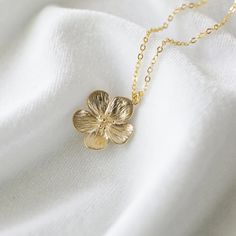 "Beautiful and lovely gold flower necklace.  Made of semi-matte finish gold flower with skinny gold brass chain.  A simple and natural-looking dainty necklace is good for yourself or gift! Your necklace will ship in a lovelike gift box. If you have any questions please feel free to contact me. Thanks :)  ♥ Chain length available 14\" - 20\"  ♥ Flower pendant 3/4\"   ♥ Gold Plated over Brass   ♥ ♥ ♥ ♥ ♥ ♥ ♥ ♥ ♥ ♥ ♥ ♥ ♥ ♥ See more by lovelikestyle lovelikestyle.etsy.com ♥ ♥ ♥ ♥ ♥ ♥ ♥ ♥ ♥ ♥ ♥ ♥ ♥ ♥ 14k Gold Filled Flower Necklace, 14k Gold-filled Flower Necklace, Gold Necklace With Flower Charm, Gold Necklace With Flower Shape For Her, Feminine Gold Pendant Charm Necklace, Gold Pendant Necklace With Flower Charm, Gold Pendant Flower Necklace With Flower Charm, Feminine Gold Pendant Charm Necklaces, Gold Flower Charm Pendant Necklace