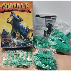 the godzilla game is in plastic bags and ready to be used as an action figure