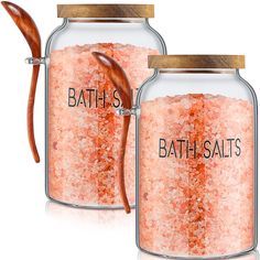 two jars filled with bath salts and a wooden spoon