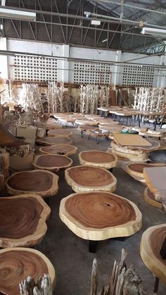 several pieces of wood sitting on top of tables in a room filled with chairs and other furniture