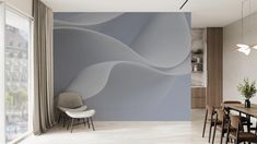 a dining room with a table and chairs in front of a wall mural that looks like waves