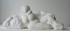 a white sculpture sitting on top of a table