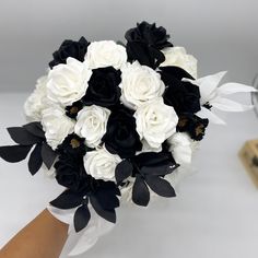 a bridal bouquet with black and white flowers