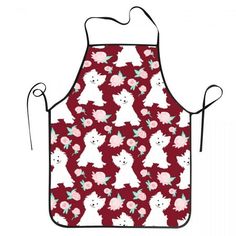 a red apron with white dogs and flowers on it