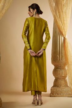 Olive green kurta with gold lace panelled on the kurta and sleeves with fringe latkans. Paired with matching pant and dupatta with contrast pink pattis. - Aza Fashions Gold Silk Churidar With Long Sleeves, Elegant Straight Kurta With Gota Work, Fitted Slub Silk Kurta For Eid, Elegant Pista Green Churidar With Straight Kurta, Gold Long Sleeve Slub Silk Kurta, Elegant Pista Green Churidar With Dabka Details, Elegant Pista Green Churidar With Dabka, Gold Traditional Wear With Dabka On Cotton Silk, Designer Straight Pista Green Kurta