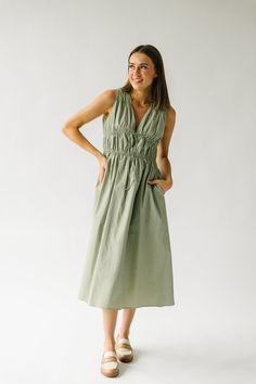 Get ready to turn heads in The Laserna Tie Detail Midi Dress in Sage! This stunning dress features a unique tie detail that adds a touch of elegance to the classic midi style. Perfect for any occasion, this dress will make you feel confident and stylish. Don't miss out on this must-have piece for your wardrobe! Details self/lining: 100% cotton Fabric Care Guide Here Sizing & Fit Measurements are approximate and taken while laying flat across the front. Not doubled. small: bust = 18"; waist = 14" Unique Ties, Nursing Friendly, Wide Leg Jumpsuit, Floral Maxi, Small Bust, Stunning Dresses, Pink Tops, Feel Confident, Floral Maxi Dress