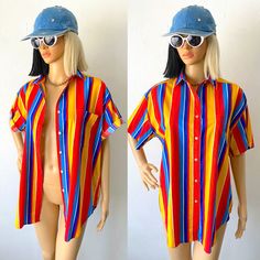 "♥ 80s / 90s Colorful, bright, cheerful wide striped button up short sleeve shirt by BEST AMERICAN.  ♥ NOTE: There is very slight vintage wear in some areas but it is only noticeable on close inspections. You can see some in the close up photo with the buttons. But it's only in certain areas and very hard to notice :) Just letting you know! ♥ Primary colors red, blue, yellow and also navy blue and white. ♥ Nice quality cotton, not too flimsy or too heavy! ♥ Fast FREE Shipping! ♥ Ask for a discount on bundles.  ♥ INSTAGRAM: franzialux_rellickroad MEASUREMENTS (FLAT)  * PIT TO PIT: 23\" (across)  * SLEEVE: 8\" (shoulder seam to end)  * SHOULDERS: 20\" (seam to seam)  * TOTAL LENGTH: 29\"   from the top of shoulder to the longest part of hem. *FIT / SIZE: Labeled Size Small (technically ladie Retro Multicolor Shirt For Vacation, Fun Multicolor Button-up Shirt, Vibrant Button-up Summer Tops, Fun Striped Summer Tops, Colorful Vintage Summer Shirt, Retro Rainbow Tops For Summer, Colorful Vintage Tops For Summer, Fun Multicolor Button-up Top, Colorful Vintage Summer Tops