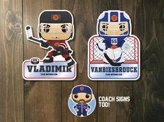 two stickers depicting hockey players on wooden boards