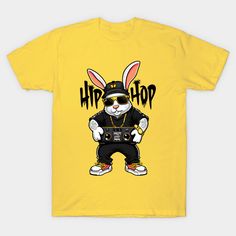 a yellow t - shirt with an image of a bunny wearing sunglasses and a hat