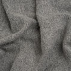 a close up view of a gray wool fabric