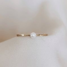 Pearl Ring Dainty Pearl Stacking Ring Minimalist Pearl Ring - Etsy Minimalist Everyday Pearl Ring With Round Band, Minimalist Stackable Adjustable Pearl Ring, Elegant White Midi Rings With Simple Design, Adjustable Stackable Minimalist Pearl Ring, Simple White Midi Promise Rings, White Simple Midi Promise Ring, Delicate Stackable Pearl Ring For Promise, Delicate Stackable Pearl Promise Ring, Delicate Stackable Pearl Ring As Promise Ring