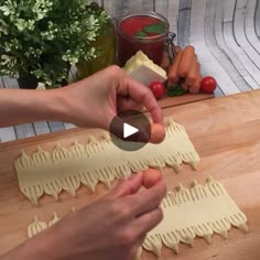 a person is making some food on a table