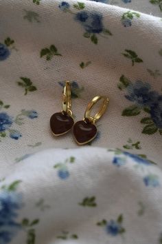 Wrap yourself in love with our Brown Heart Huggies! These delicate earrings are simply made to go with any outfit. These earrings are lightweight and comfortable for all-day wear. Size- 1.0 inch drop, Width 0.4 inches Materials - Zinc Alloy Cute Heart-shaped Earrings For Everyday Wear, Cute Everyday Earrings With Heart Charm, Cute Heart-shaped Everyday Earrings, Cute Everyday Heart-shaped Earrings, Trendy Hypoallergenic Heart Drop Earrings, Trendy Hypoallergenic Heart Earrings For Gifts, Valentine's Day Single Heart Earring For Everyday, Cute Heart Charm Huggie Earrings, Cute Huggie Earrings With Heart Charm