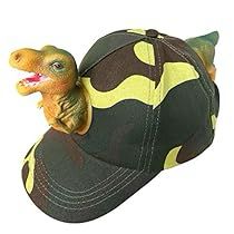 a toy dinosaur riding on top of a baseball cap