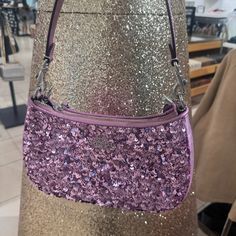 Sequins, Foil Metallic Smooth Leather And Metallic Refined Calf Leather Two Credit Card Slots Inside Multifunction Pocket Zip-Top Closure, Fabric Lining Detachable Handle With 8 1/4" Drop Detachable Strap With 22 3/4" Drop For Shoulder Or Crossbody Wear 9 1/2" (L) X 6" (H) X 3" (W) Style No. Cq556 Coach Evening Baguette Shoulder Bag, Coach Baguette Evening Shoulder Bag, Evening Coach Baguette Shoulder Bag, Coach Purple Shoulder Bag For Evening, Coach Purple Evening Bag, Trendy Coach Bag With Zipper Closure, Chic Coach Party Bag, Luxury Coach Bag For Party, Luxury Coach Party Bag