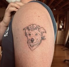 a dog with a hat on his head is shown in the upper half of this tattoo