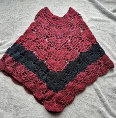 "Welcome to my Store.  Here I am offering a lovely handmade women's crochet poncho. This super soft yarn is a blend of 100% Worsted Acrylic Yarn and is completely machine washable.  You are buying the one in the first picture. This poncho has the perfect blend of colors for a brisk fall day with plays of burgundy and black. I used Caron and Lion Brand Yarn to make these ponchos (see pictures). The poncho is one size fits all. As you can see in the second picture of me wearing one it hits right near my upper thighs and I am 5'5\".  We can also customize color of poncho, just message me with details of color. Any questions please contact me.  Please check out my other items. More to come. All my items are prewashed and cleaned before shipping out. I will try to ship out all orders 7 business Black Bohemian Crochet Poncho, Cozy Crochet Shawl One Size, Handmade Black Shawl Poncho, One Size Crochet Yarn Shawl, Handmade Yarn Poncho One Size, Crochet Yarn Shawl, Handmade One-size Yarn Poncho, Handmade Yarn Poncho, Handmade Black Poncho One Size