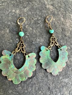 Handpainted and embossed scalloped veg tan leather earrings dangle from antiqued brass filigree connectors and one turquoise bead. finished with antiqued brass lever backs. Perfect for fall picnics at the arborteum, visiting the pumpkin patch, running errands around town, wine tastings, art festivals and  just enjoying life! Lightweight, these earrings are equally at home worn out on the town or to work.  I support Etsy sellers, these earrings were made from components purchased on Etsy! Not you Bohemian Bronze Earrings With Patina, Bohemian Brown Jewelry With Patina, Vintage Patina Jewelry For Festivals, Vintage Patina Jewelry For Festival, Artisan Brown Earrings With Patina, Bohemian Festival Earrings With Patina, Bohemian Turquoise Hand-tooled Earrings, Adjustable Brown Earrings With Patina, Artisan Brown Patina Earrings