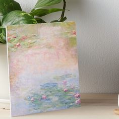 water lilies in a pond with pink flowers art board print