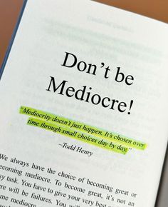 an open book with the words don't be mediocre written on it