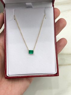 Featured here is a fine quality 0.80-carat stunning, East to West emerald necklace in fine 14K yellow gold. Displayed in the center is a vivacious green emerald with great clarity, accented by a simple four-prong gold mount, allowing for the emerald to be shown in full view. The earth mined, green emerald has a desirable lush green color with excellent qualities. An 18 inch is attached to the emerald pendant. This necklace is ideal for everyday use and is the perfect accessory to any outfit. Tot 14k Gold Emerald Cut Fine Jewelry Necklace, Green Diamond-cut 14k Gold Necklace, Yellow Gold Necklace With Emerald Cut Bezel Setting, 14k Gold Green Diamond Cut Necklace, Yellow Gold Emerald-cut Necklace With Bezel Setting, Yellow Gold Emerald Cut Necklace With Bezel Setting, Emerald Cut Green Diamond Necklace Gift, Emerald Necklace With Diamond Cut In Fine Jewelry Style, 14k Gold Emerald Cut Solitaire Necklace