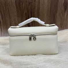 Color: Off-White, Black, Light Gray, Gray Outer 100% full grain leather Vegan Leather Lining One main compartment Silver-tone hardware Measurement:  W19cm, D6cm, H 11cm (7*2*4") Luxury White Pouch Box Bag, Luxury White Rectangular Case Bag, Luxury Pouch With Large Capacity For Daily Use, Luxury Large Capacity Pouch For Daily Use, White Classic Rectangular Case Bag, Classic White Rectangular Case Bag, Luxury Portable Office Bag, Classic White Box Clutch Bag, Portable Leather Pouch