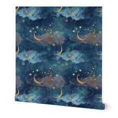 a blue wallpaper with stars and crescents on the night sky in gold foil