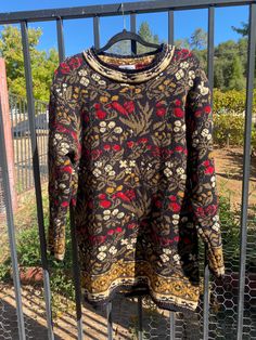 Super slouchy, long sleeve, knitted sweater that is perfect for the Fall & Winter weather.  Amazing floral & foliage pattern throughout in hues of olive green, marigold, cherry, cream, and ebony.  A soft & cozy sweater that looks great over a slip dress or maxi skirt. In great vintage condition.  No stains or holes to note, only few loose threads that are barely visible. Tag says: L/fits true to size Label: Land's End Foliage Print, Floral Foliage, 90s Floral, Land's End, Vert Olive, Long Sleeve Knit Sweaters, Cozy Sweater, Winter Weather, Size Label