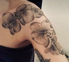 a woman's arm with flowers on it