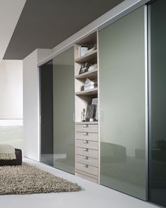 a bedroom with white walls and carpeted flooring