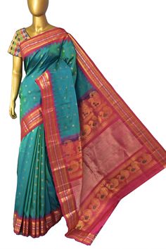 A pure enigmatic collection in golden color with the golden buti and silver zari border, with peacock motif on the pallu and meenakari butta work on spread across the saree in plaintive for, done in the traditional handloom style makes it a classic choice of many. Color: A shade of dual tone blue and green color Technique: Amazing work of golden zari buti work on the body with traditional weaving Fabric: Paithani Quality: Indyvogue's Assurance of Pure Silk Mark Certified Saree Transitional Season Gold Paithani Silk Traditional Wear, Ceremonial Paithani Silk Saree For Festivals, Diwali Saree With Zari Work And Temple Jewelry Style, Tussar Silk Traditional Wear With Peacock Design For Wedding, Ceremonial Paithani Silk Traditional Wear For Festivals, Diwali Art Silk Saree With Peacock Design, Diwali Traditional Saree With Peacock Design, Green Ceremonial Saree For Transitional Season, Ceremonial Green Saree For Transitional Season