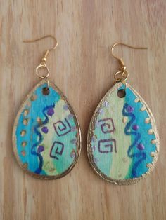 Hand painted wooden earrings with gold trim Gold Hand-painted Teardrop Earrings, Gold Hand Painted Teardrop Earrings, Gold Teardrop Earrings Hand Painted, Gold Bohemian Earrings With Wooden Beads, Bohemian Hand Painted Gold Earrings, Bohemian Gold Hand Painted Earrings, Artistic Hand Painted Gold Earrings, Abstract Ideas, Wooden Earrings