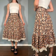 Stunning 70s brown floral prairie skirt with lace trim!  Size Small Brand - Lori Ann / Union Made Era - 70s Great Vintage Condition (FLAW - some very minor fraying on the lace) Made in Canada Measurements LAYING FLAT Waist - 12.5" Hips - 21" Length - 31" Please let me know if you have any questions! Vintage Floral Print Tiered Skirt, Vintage Brown Tiered Skirt, Brown Vintage Tiered Skirt, Vintage Brown Flowy Skirt, Vintage Tiered Skirt With Floral Print, Vintage Cotton Brown Skirt, Vintage Long Skirt With Lace Trim, Vintage Brown Skirted Bottoms, Vintage Lace Trim Skirt For Summer