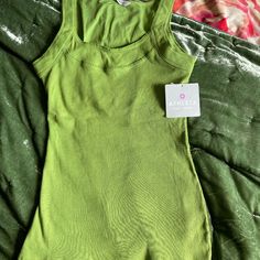 Athleta Green Tank. Size M New With Tags. Spring Athleisure Tank Top With Crew Neck, Spring Crew Neck Tank Top In Athleisure Style, Spring Athleisure Crew Neck Tank Top, Green Athleisure Activewear With Tank Straps, Green Seamless Tank Top For Loungewear, Green Scoop Neck Tank Top For Loungewear, Green Seamless Tank Top For Workout, Green Sporty Activewear With Tank Straps, Green Stretch Athleisure Tank Top