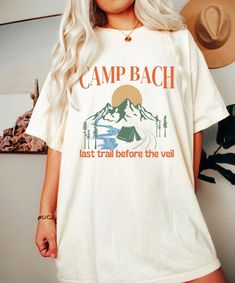 Camp Bachelorette Shirt, Comfort Colors, Camp Bach Shirt, Camping Shirt, Mountain Bachelorette, Camp Themed Bachelorette, Wild in The Woods *IMPORTANT PLEASE READ BEFORE PURCHASING* My store uses DTG (Direct to Garment) printing. This means the design is printed into the garment. This means it is designed to last longer than other printing processes. Due to this printing process the design colors may not be as vibrant as shown in the photos. There may at times be a slight difference between real Summer Camping Shirt With Graphic Print, Summer Graphic Print Camp Shirt, White Summer Tops For Camping, Summer Camping Shirt With Crew Neck, Summer Crew Neck Shirt For Camping, Casual Summer Camp Shirt For Hiking, Summer Hiking Crew Neck Shirt, Summer Crew Neck Shirt For Hiking, Summer Graphic Print Shirt For Hiking