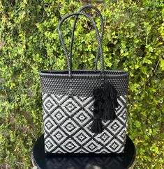 This handmade Large woven Mexican bag is a true work of art, crafted by skilled artisans in Mexico. It is 100% handmade with the utmost care and attention to detail. The bag is made of recycled plastic, making it not only beautiful but also environmentally conscious. It is a unique and sustainable accessory that will surely turn heads and make a statement.  Each bag takes about 16hrs to make. We work closely with the artisan in picking the color and style. Perfect for work, beach, gym, pool, pic Black Handmade Rectangular Beach Bag, Handmade Rectangular Black Beach Bag, Handmade Black Rectangular Beach Bag, Rectangular Travel Bag With Weaving Work, Handmade Black Beach Bag For Travel, Eco-friendly Woven Beach Bag For Travel, Rectangular Weaved Bags As Gifts, Rectangular Crochet Bag With Weaving Work, Rectangular Woven Bags As Gift